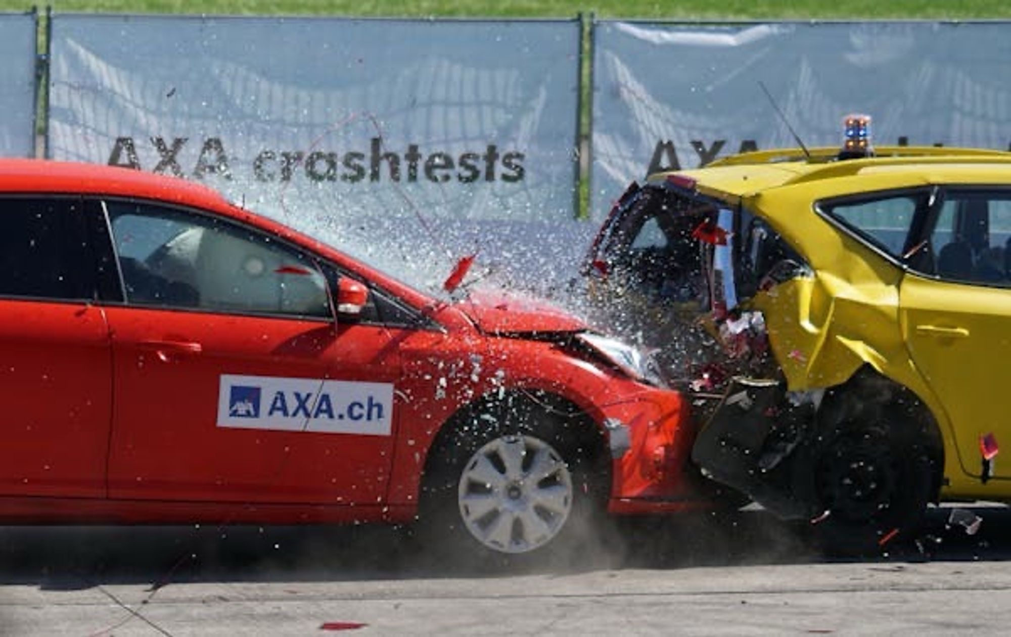 A red car hitting the rear bumper of a yellow car